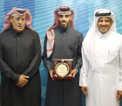 Hassan Al-Haydos receiving his award